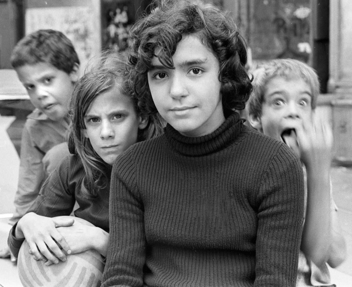 Orlando, Juanita, Blanca, and Fernando in a park on East 3rd Street, 1974.