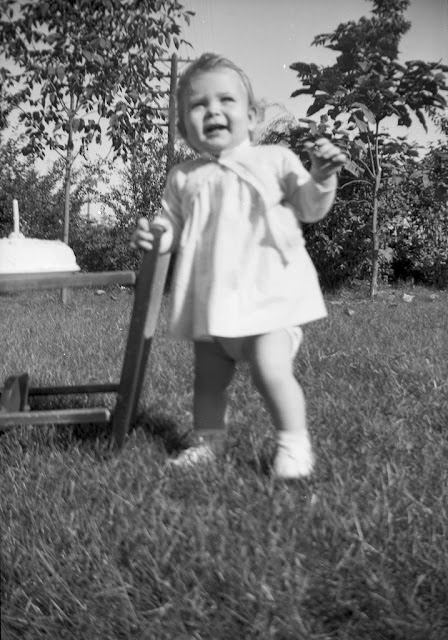 1 candle. Here she is at one year old, October 1948.