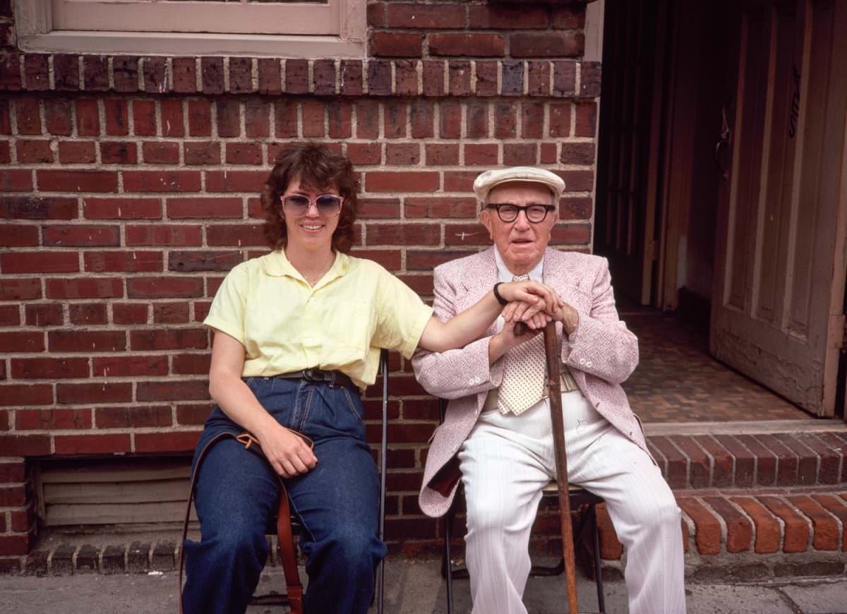 Mr Katz and Meryl Meisler sitting outside his appartment house on the Lower East Side, 1977