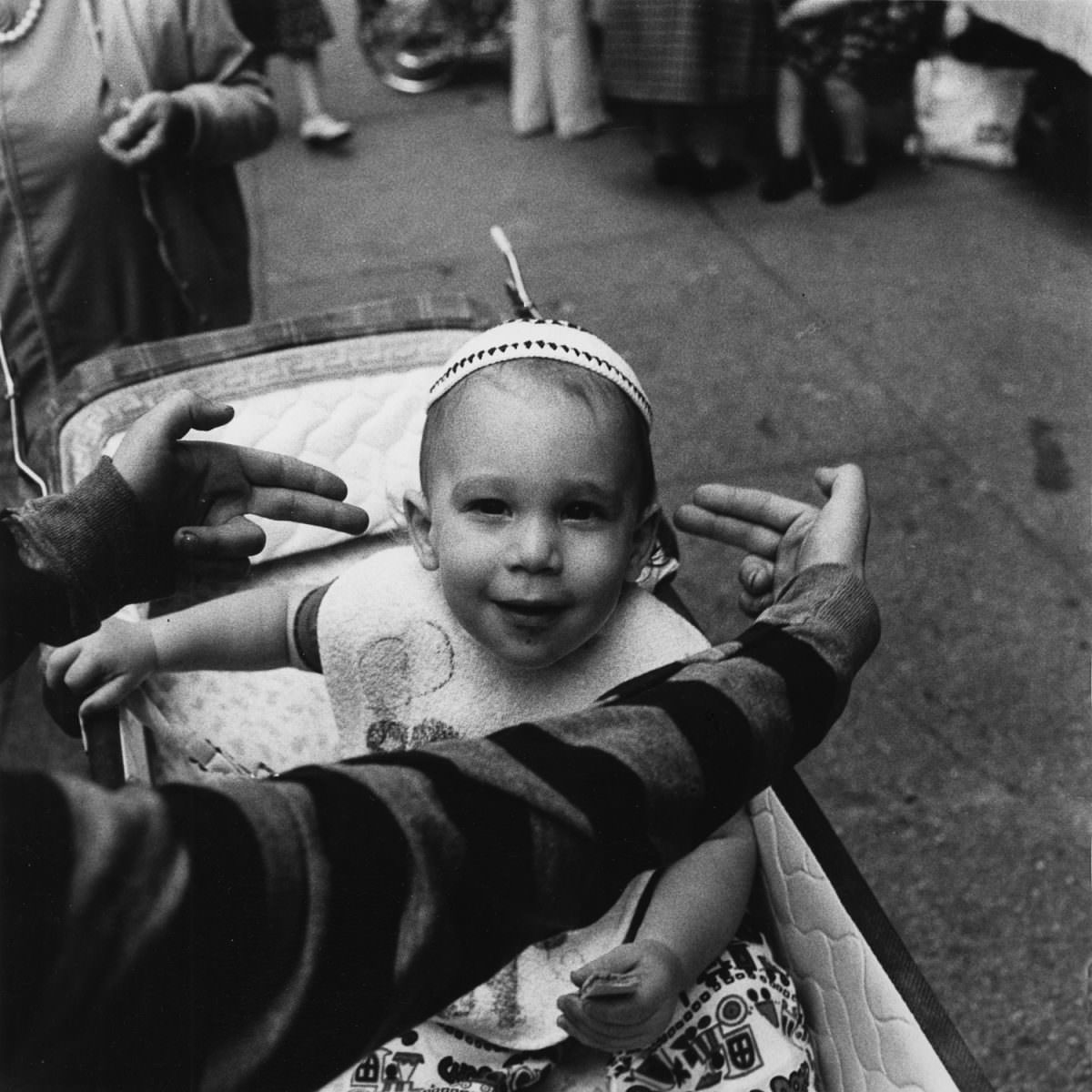 A future Talmudic student being pointed out by my photography student Michael Marsh at The Lower East Side Street Festival, 1978