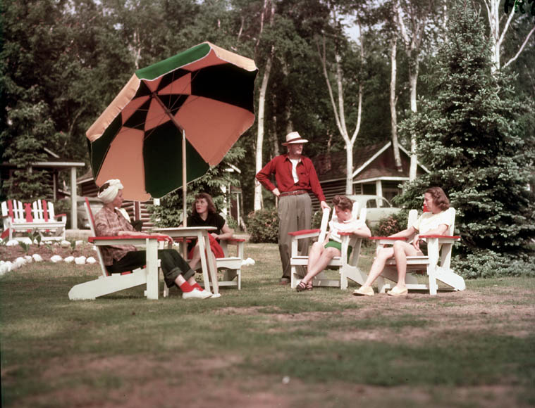 Visitors relax on the lawn at the Star Cabins resort in Ontario