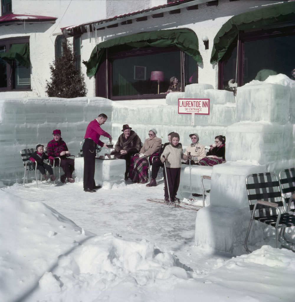 Coffee is served outdoors to guests at the Laurentide Inn winter resort in the Laurentians, Sainte-Agathe-des-Monts, Quebec, 1953