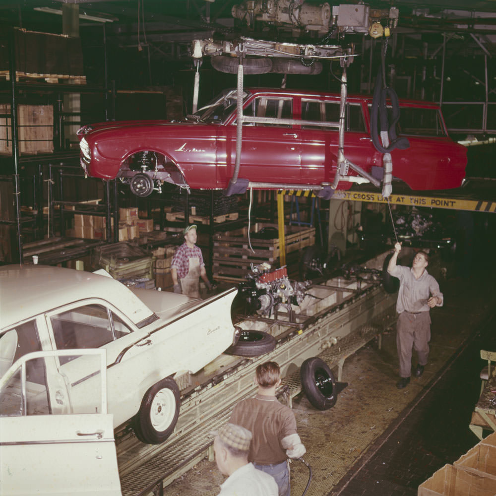 Lowering car onto production line tracks, Ford Motor Company of Canada, 1961