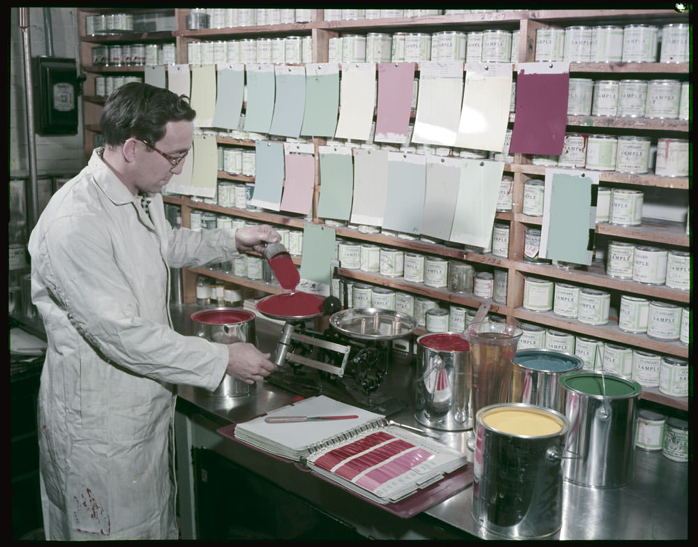 Paint technician Jean Bedard is tinting in the Control Laboratory at Ottawa Paint Works, Ontario ,1955