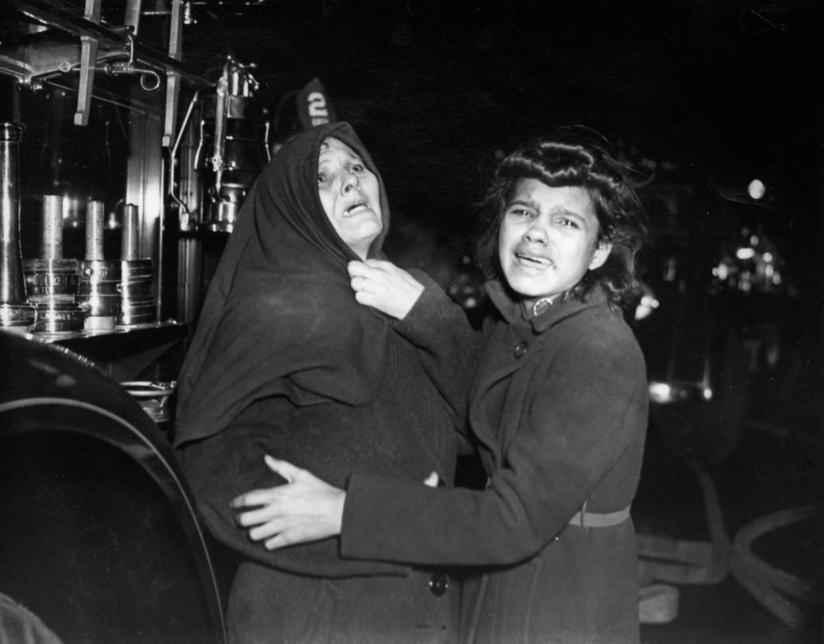 Henrietta Torres and her daughter Ada outside a tenement fire, 1939.