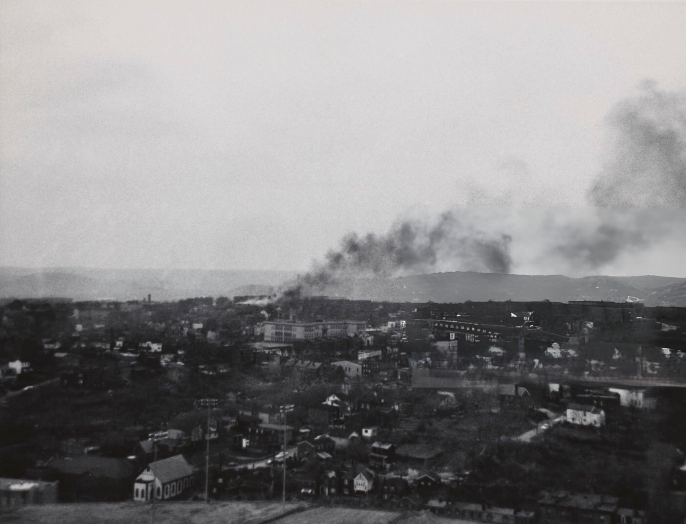 Smoke rises from the city