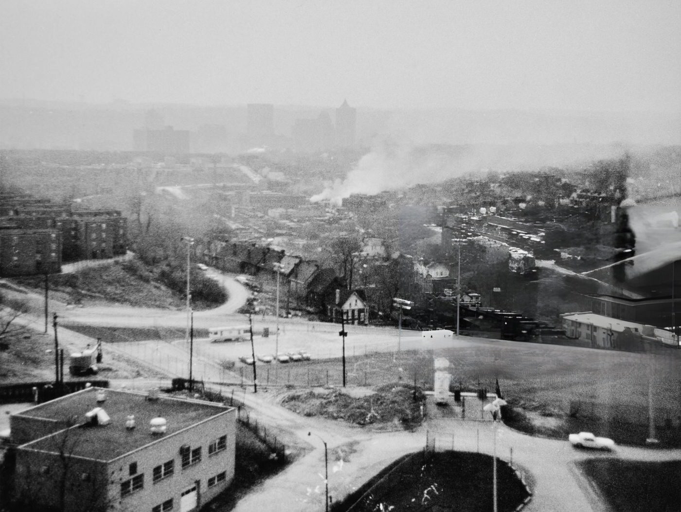 Smoke rises from the city