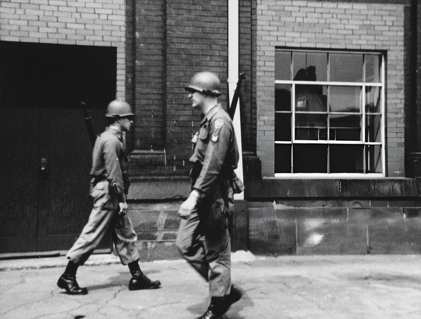 Armed officers of the National Guard patrol the streets