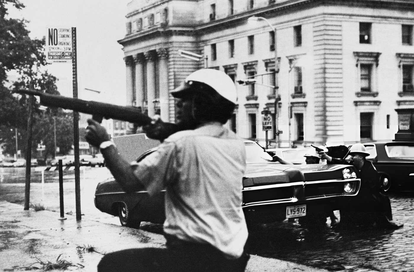Newark police officers and state troopers exchange fire with a sniper