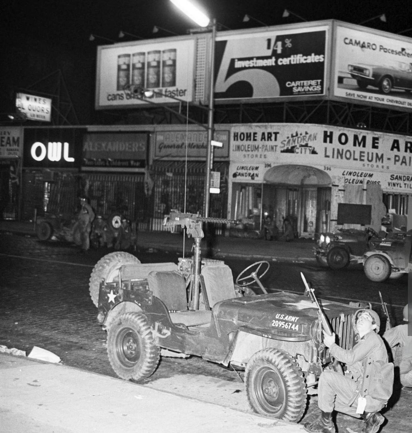 National Guard soldiers in ambush behind a jeep armed with a light machine gun