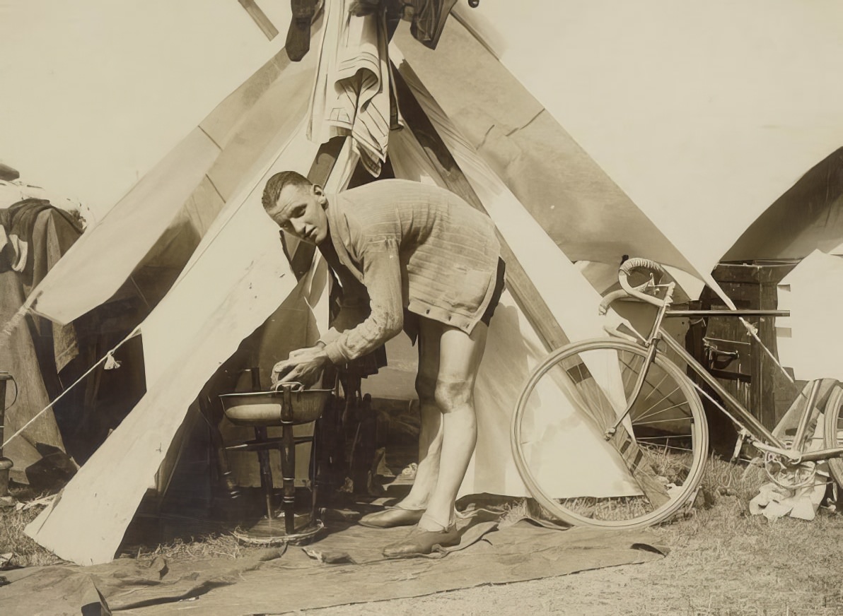 Cyclists camp during a road race.