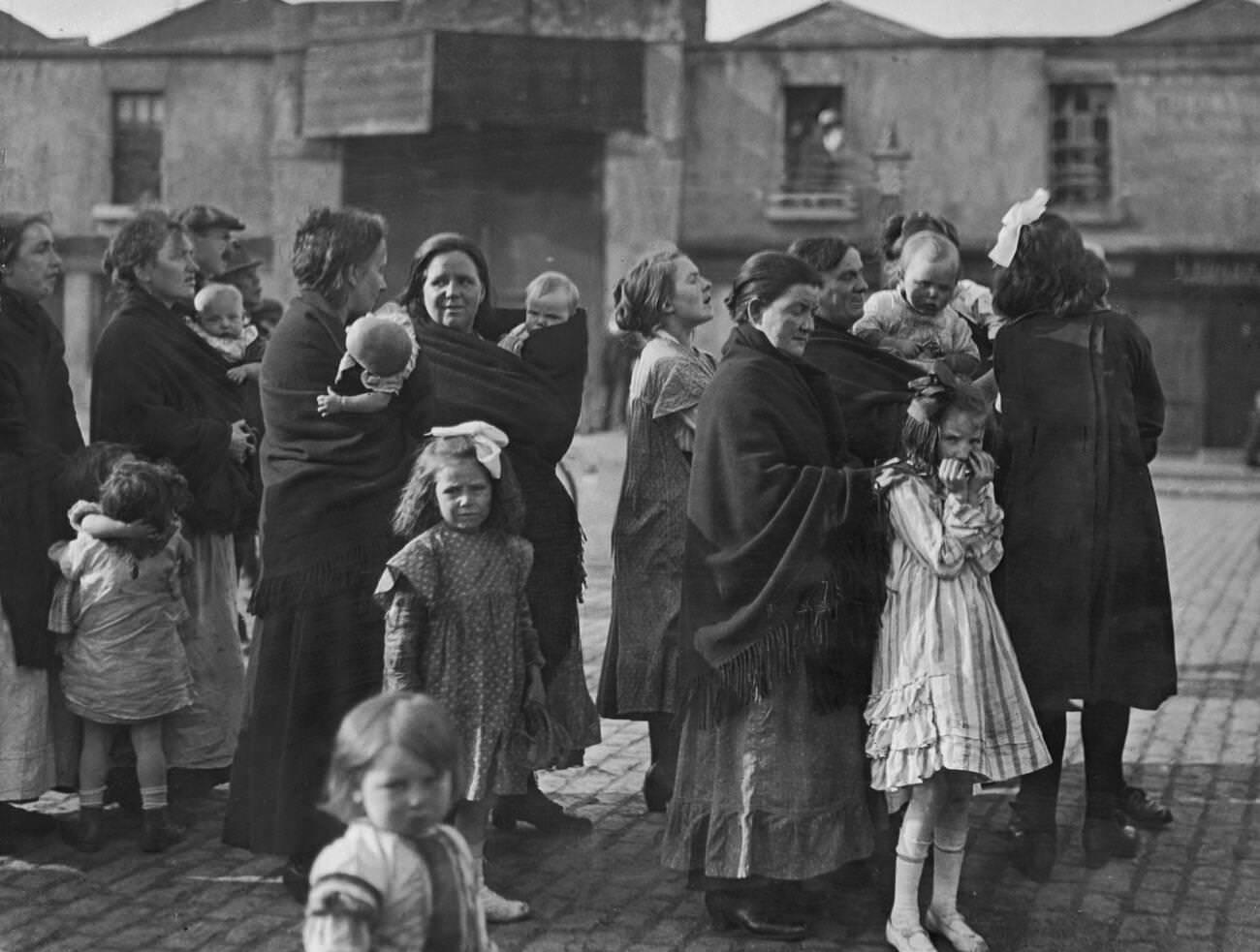 Irish mothers and their babies listening to speeches from the Panel Coalition candidate in mid Dublin during the 1922 Irish elections, 1922.