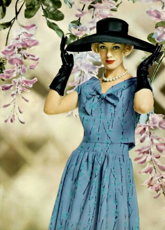 Barbara Cailleux in a printed silk dress, long-waisted with a short bolero top, by Pierre Balmain, 1958.