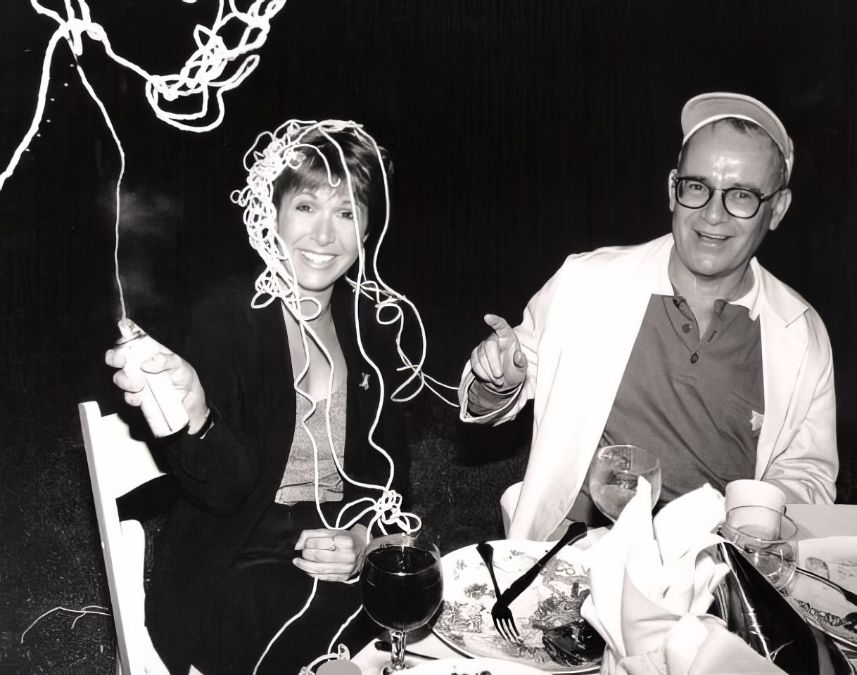 Carrie Fisher and writer/actor Buck Henry at a small party to launch the film "Down and Out in Beverly Hills".