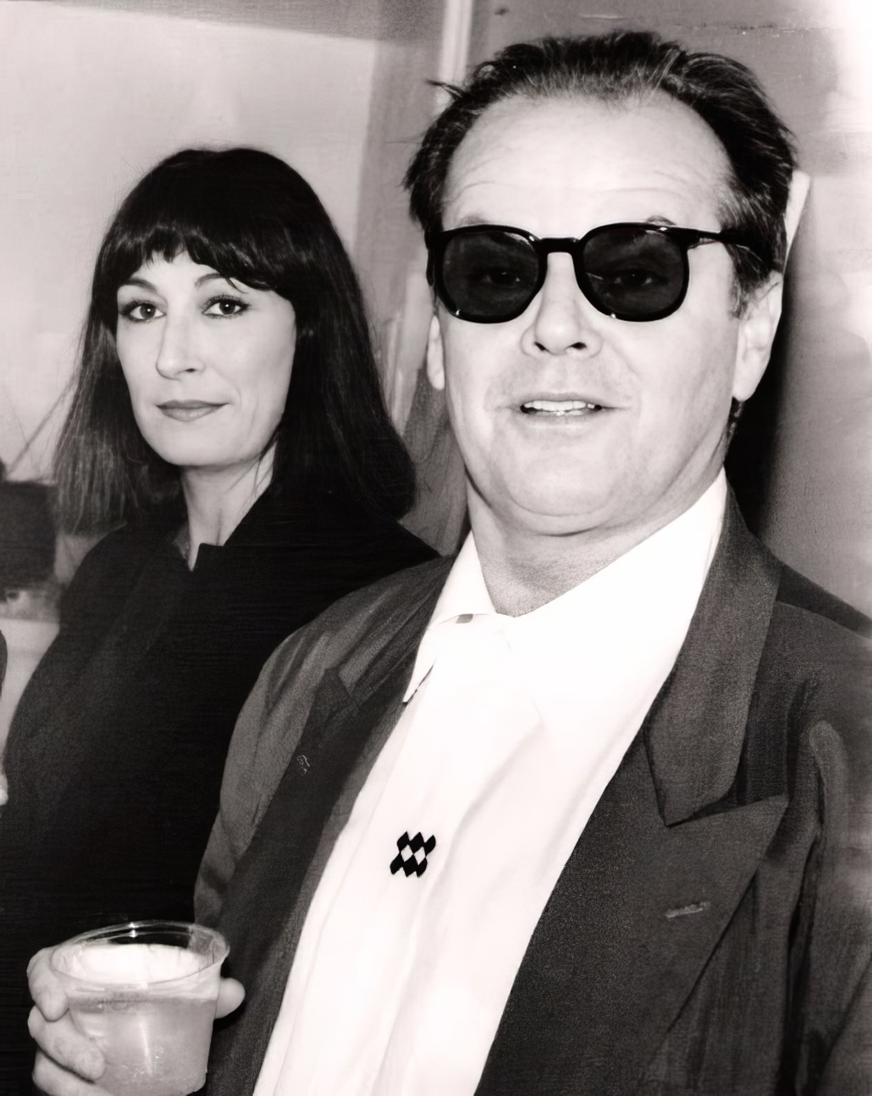 Anjelica Huston and Jack Nicholson, cornered at an art opening in Beverly Hills.