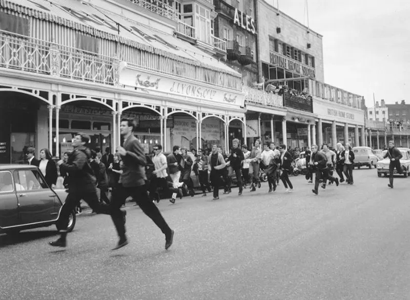 Mods flee the scene after a brawl with rockers in Margate, England, 1964.