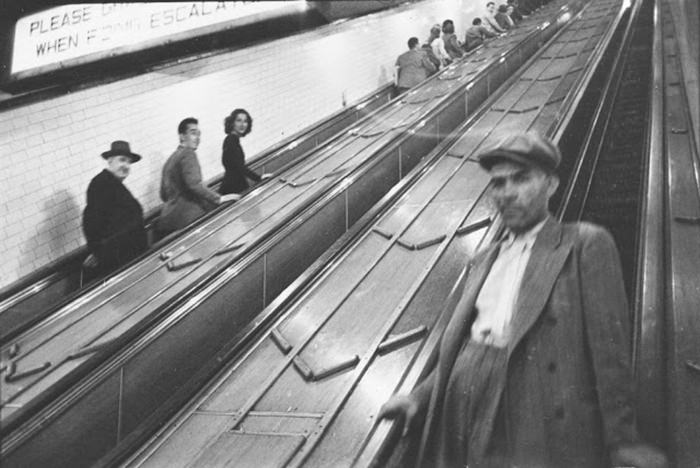 People on escalators in a subway station, 1940.
