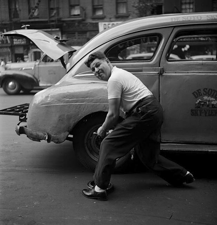 Changing a tire, 1946.