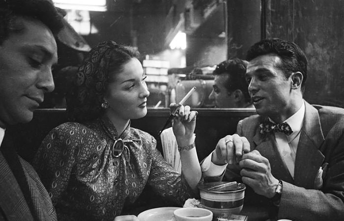 Rosemary Williams at a restaurant with two men.