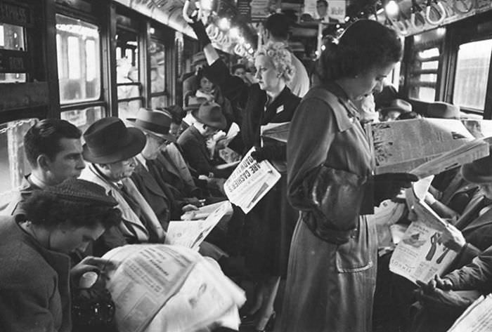 Passengers reading in a subway car, 1946.