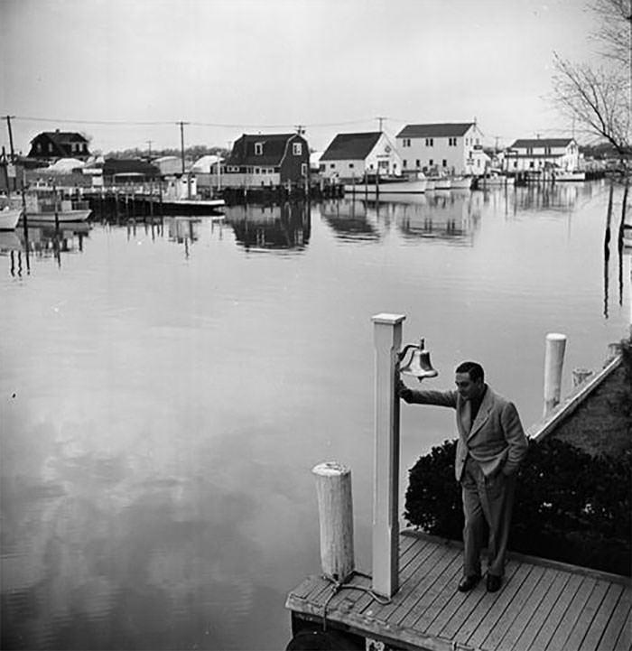 Guy Lombardo on a dock, 1940s.