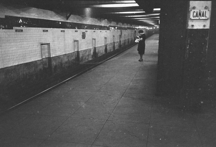 A woman waiting on a subway platform, 1946.