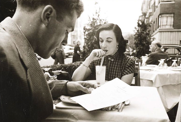 At an outdoor cafe with a woman, 1948.