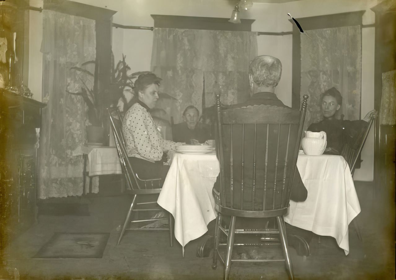 Family seated in dining room