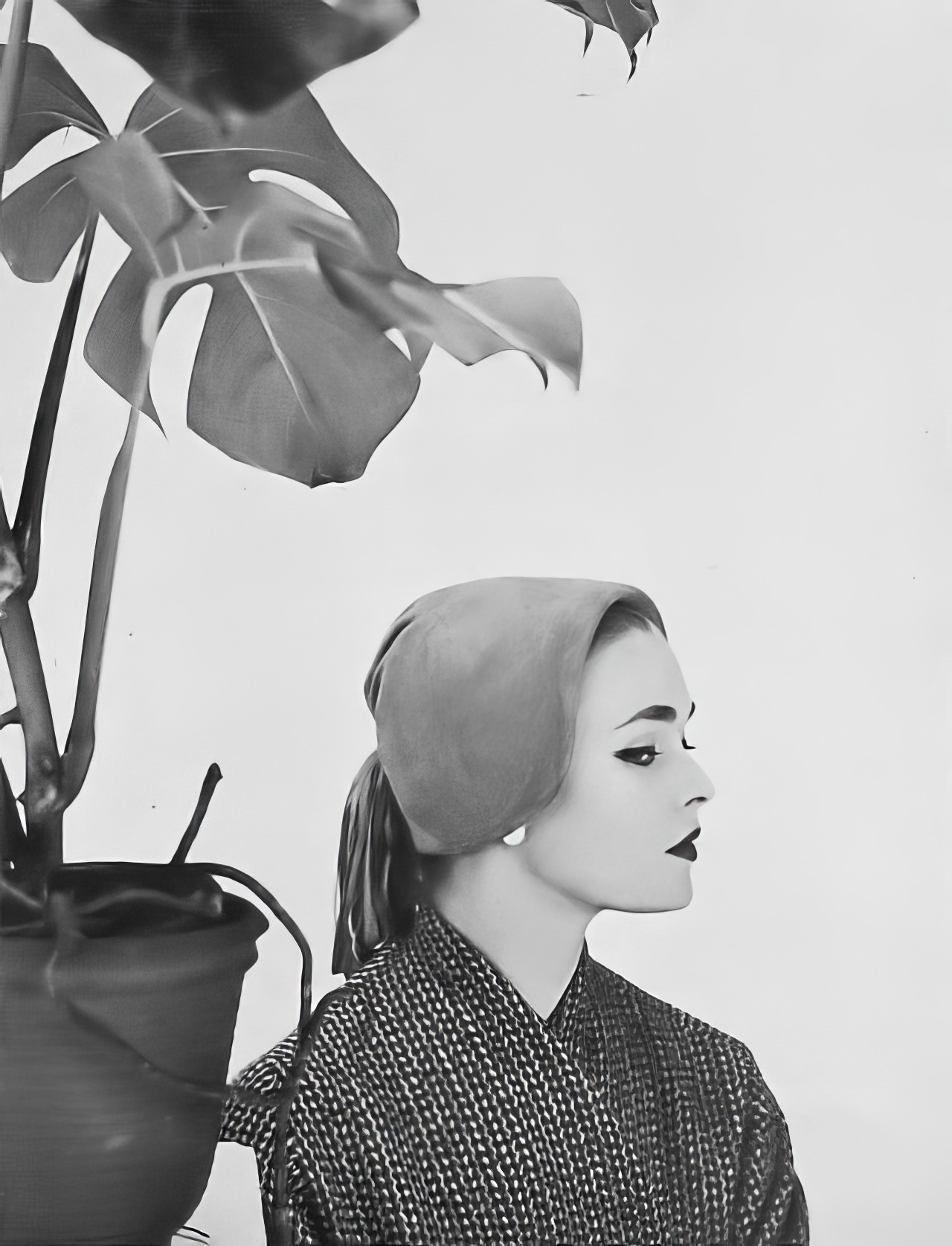 Susan Abraham wearing a mustard-colored suede cap, 1952.