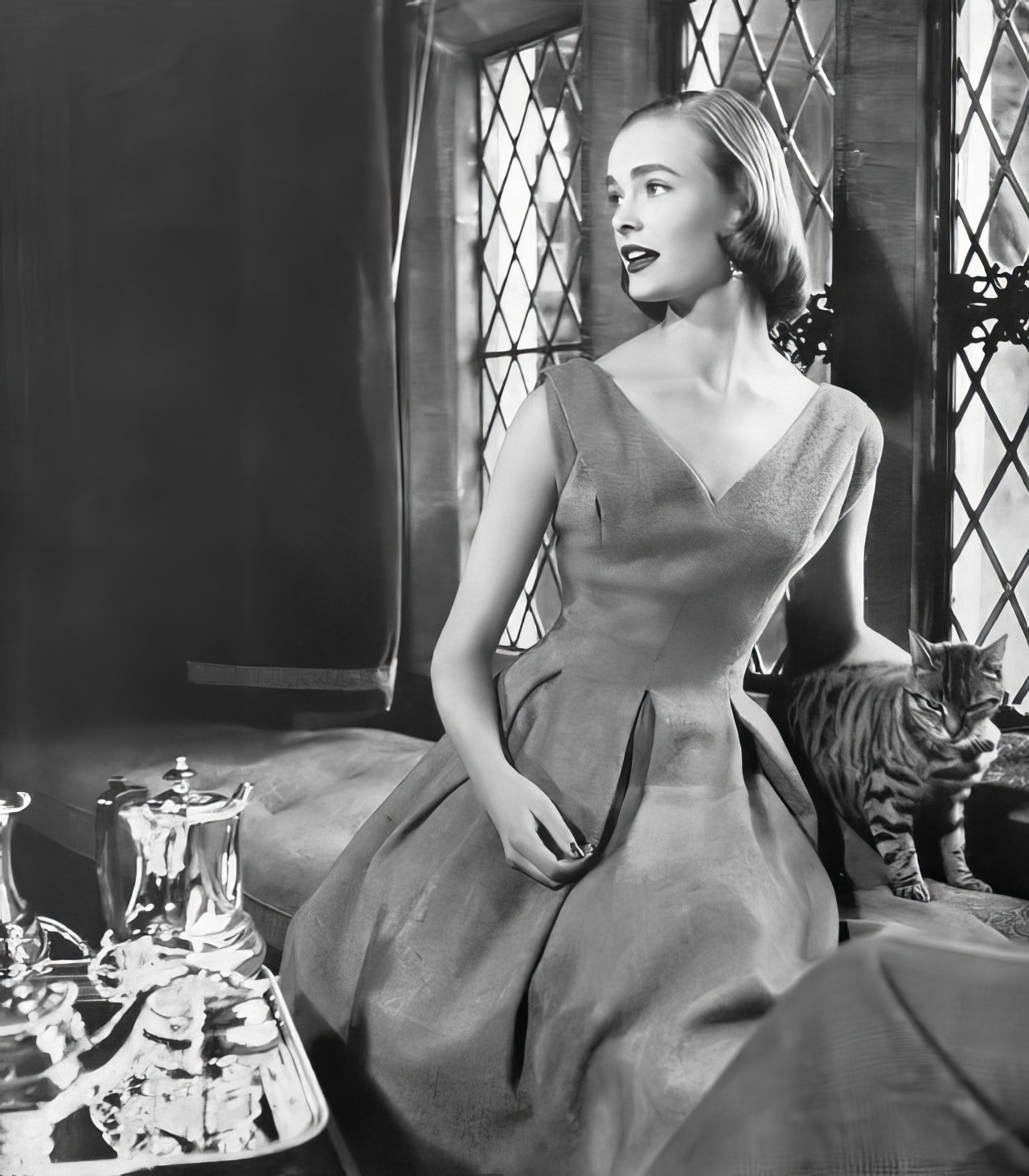 Susan Abraham in a lime-green tweed dress, 1953.