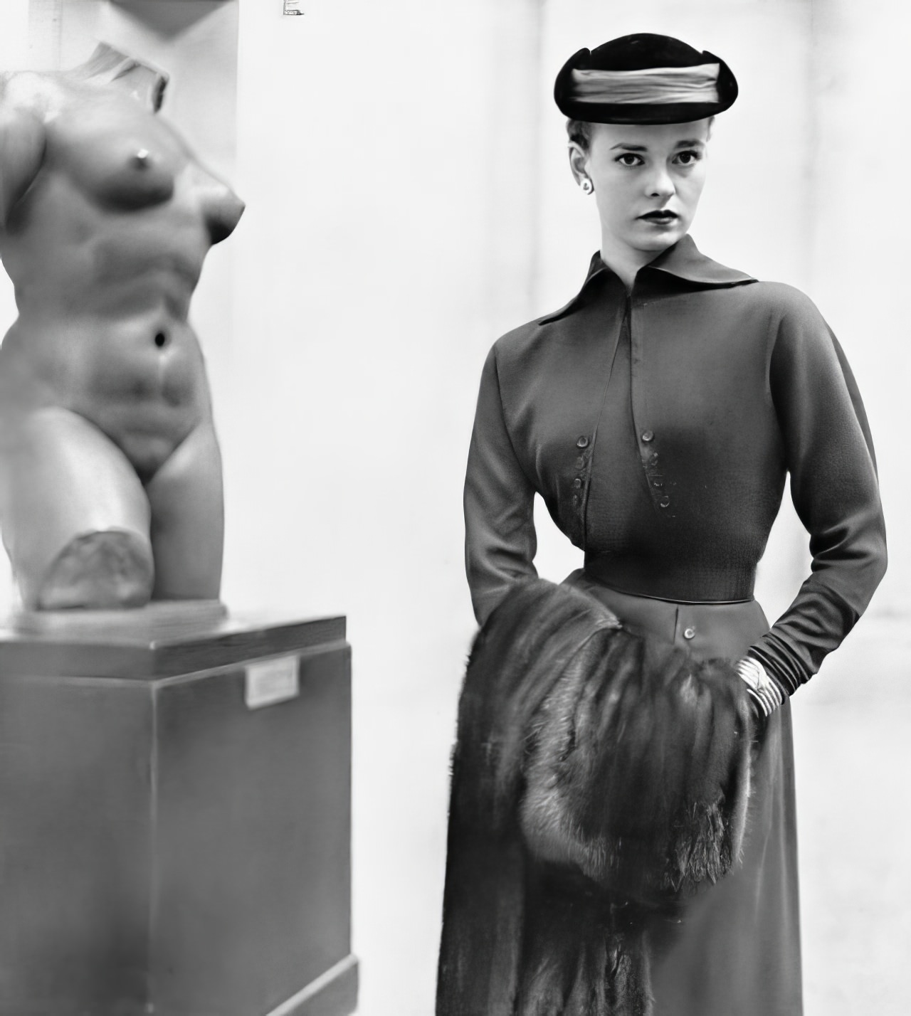 Susan Abraham in a bottle-green wool dress with a bolero-like bodice, 1951.