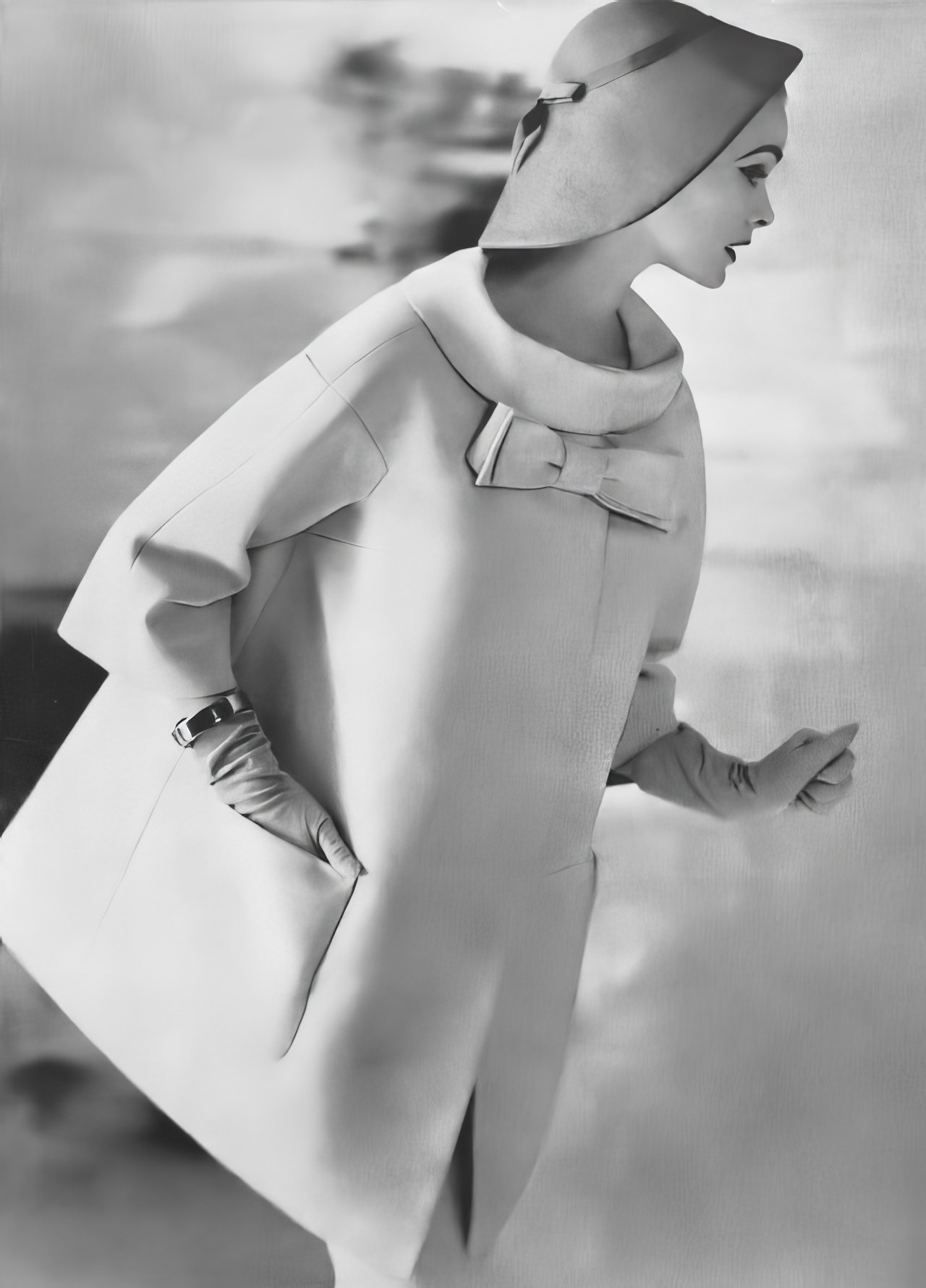 Susan Abraham in a champagne-colored coat in linen hopsack, 1957.