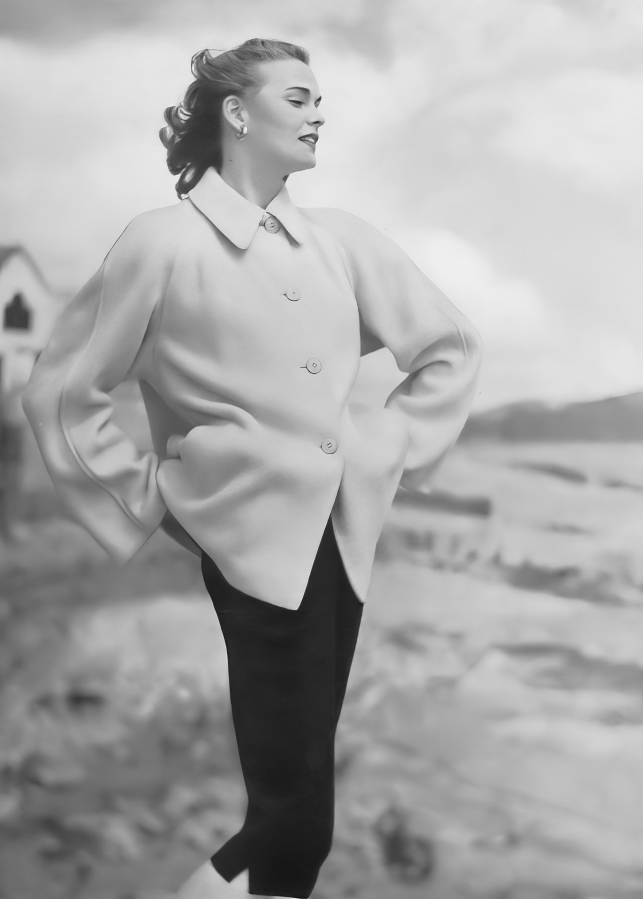 Susan Abraham in a boxy wool jacket in canary yellow over navy-blue jeans, 1952.