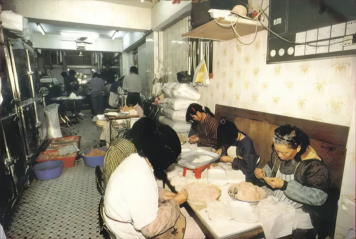 People working in a restaurant on the Kowloon Walled City.
