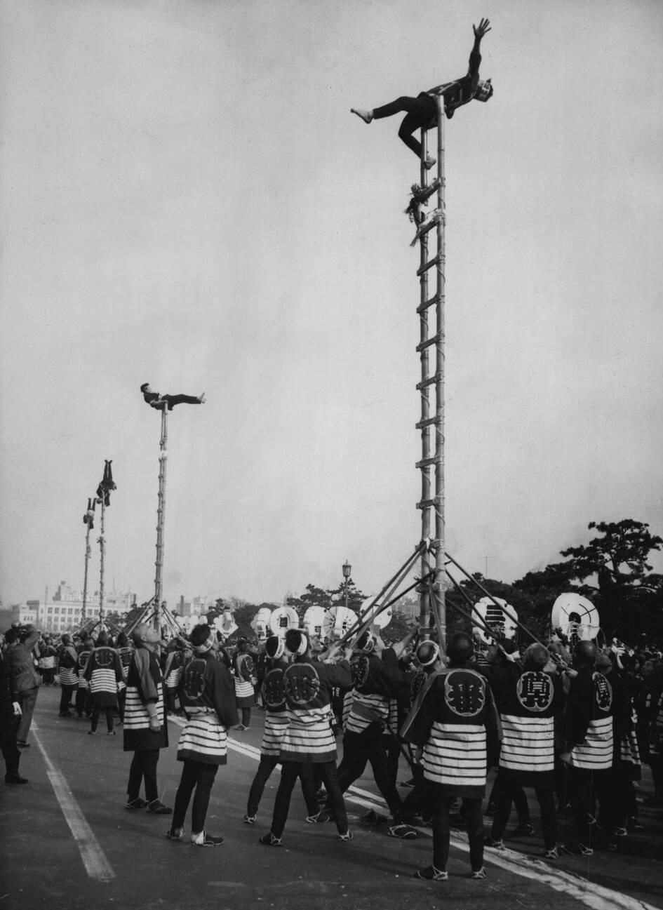 Japanese firemen staged their colorful annual pageant in the grounds of the Imperial Palace in Tokyo, 1955.