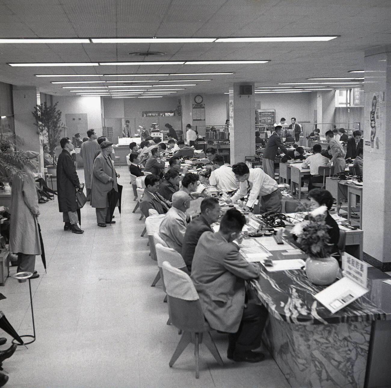 Customers inside a banking hall in Tokyo, 1950s.