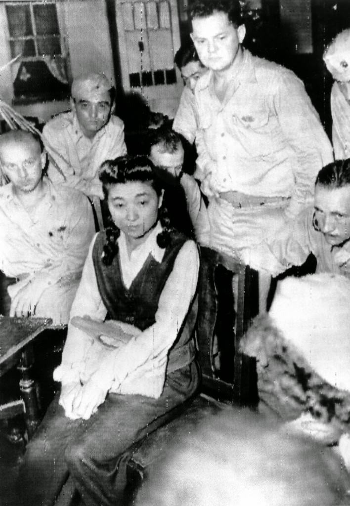 Iva Toguri D’Aquino is interviewed by American journalists in Yokohama, Japan shortly before she is held in detention. She is known as Tokyo Rose, a radio personality whose program “Zero Hour” broadcast Japanese propaganda to the Allied troops during World War II, 1945.