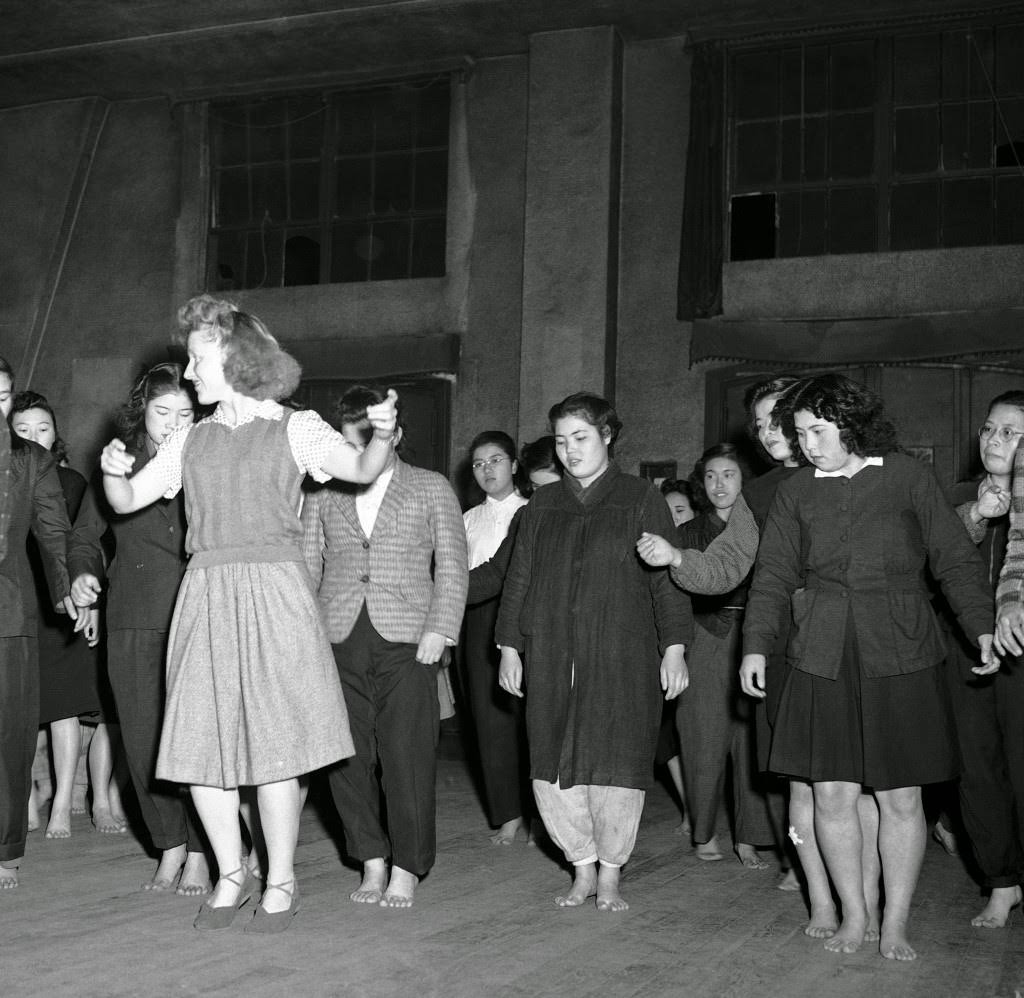 Barbara McBride teaches Russian-style Korobotchka dance to her Japanese students at the YWCA in Tokyo, 1946.
