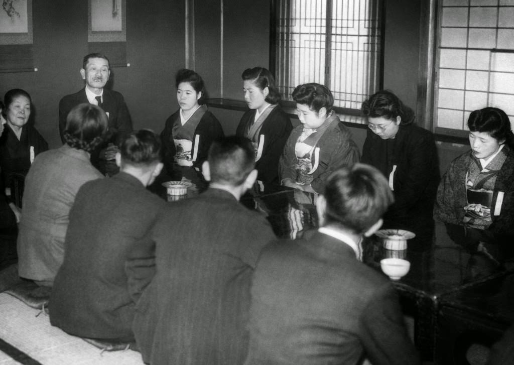 Eight girls and four men met with matrimony as the object at the Myogetsu-En, behind the Ueno Art Museum in Tokyo, 1947.