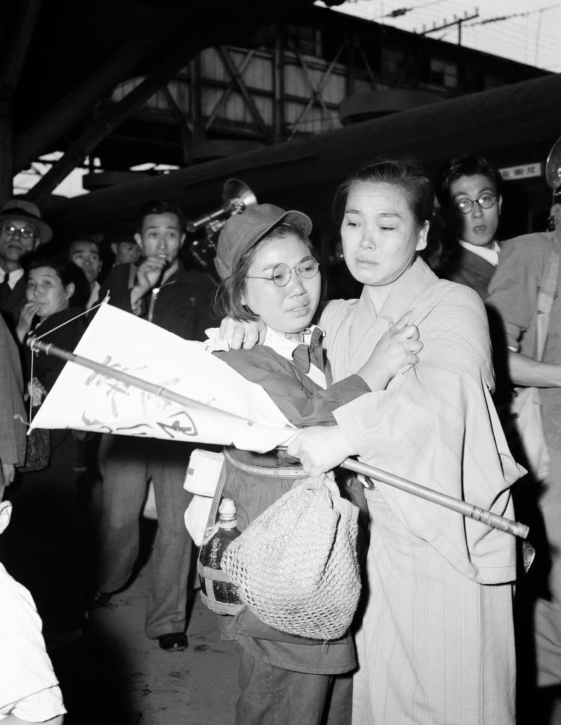 A mother and daughter meet after ten years of separation at Tokyo station, 1949.