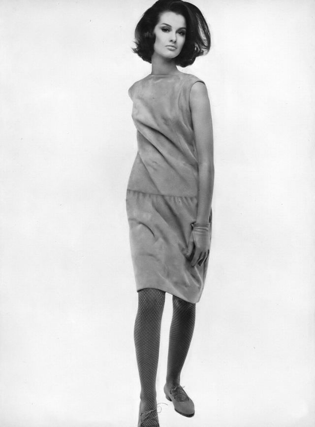 Veronica Hamel in a pale apple-green suede skimmer, 1964.