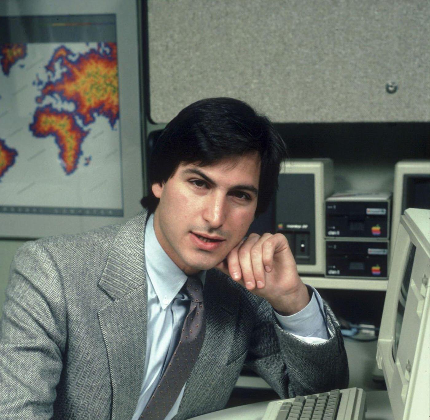 Steve Jobs sitting with the "Lisa" Computer, 1982.