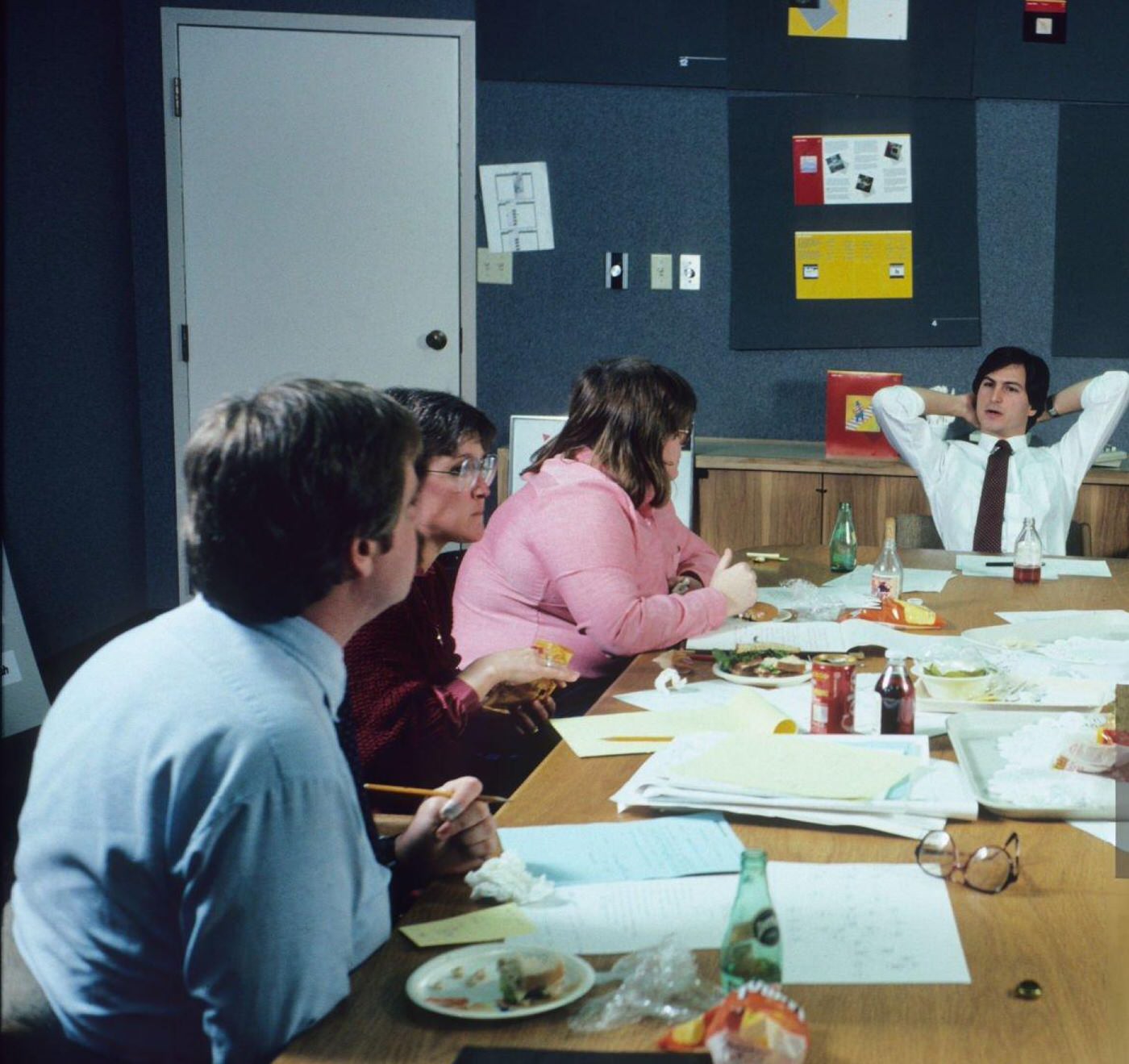 Steve Jobs leading a lunchtime huddle with his design team at Apple Headquarters, 1982.