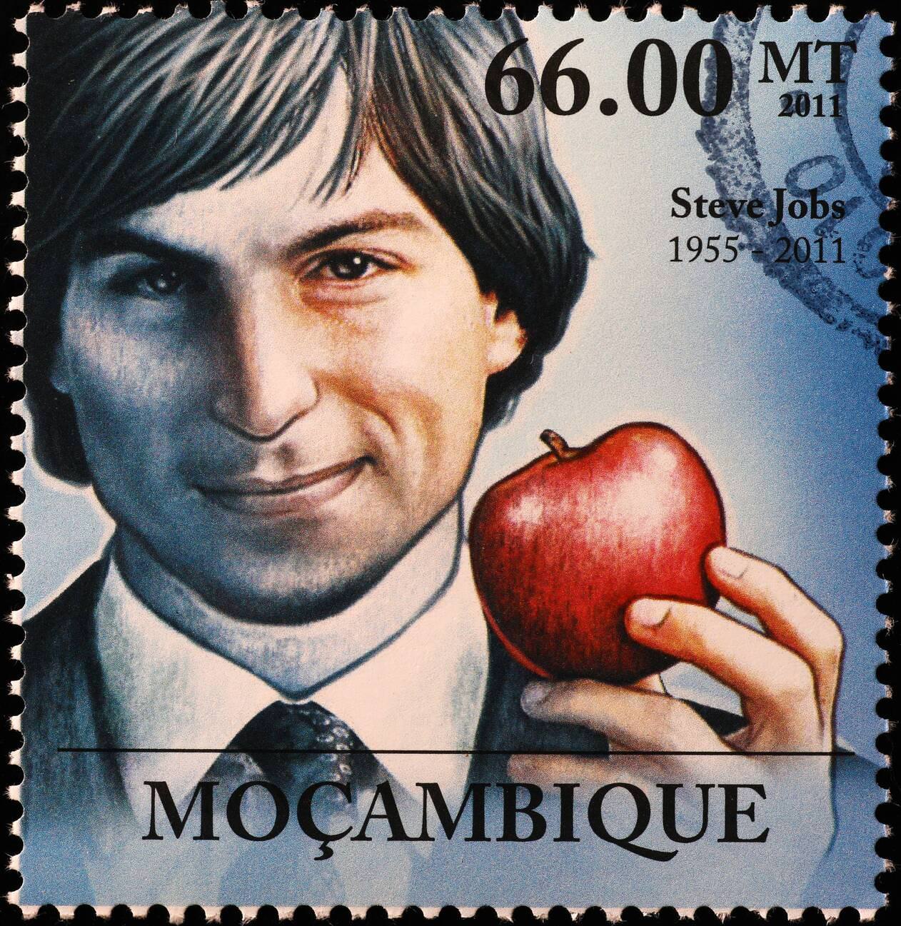 Young Steve Jobs with an apple on a postage stamp.