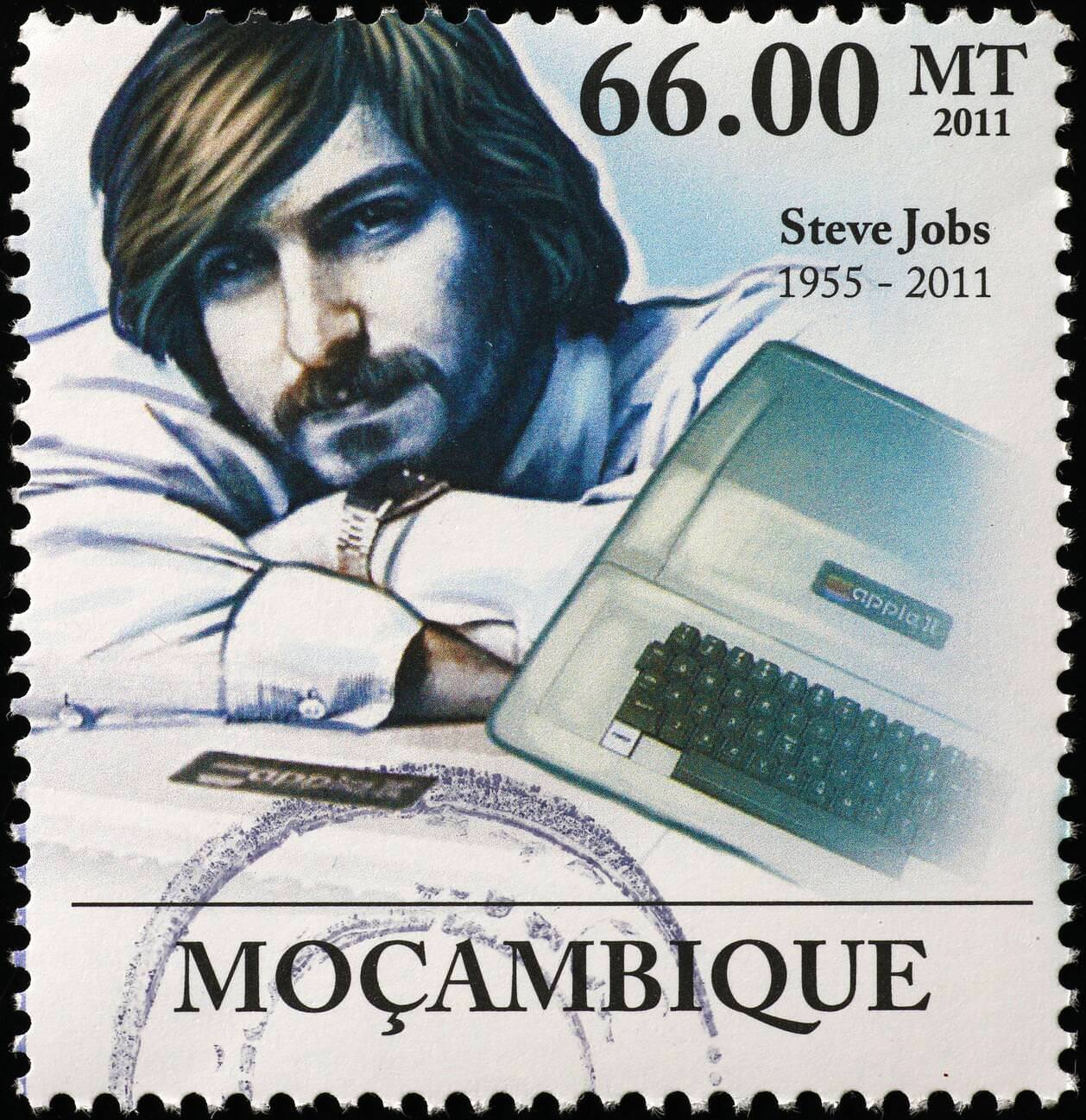 Young Steve Jobs with an Apple computer on a postage stamp.