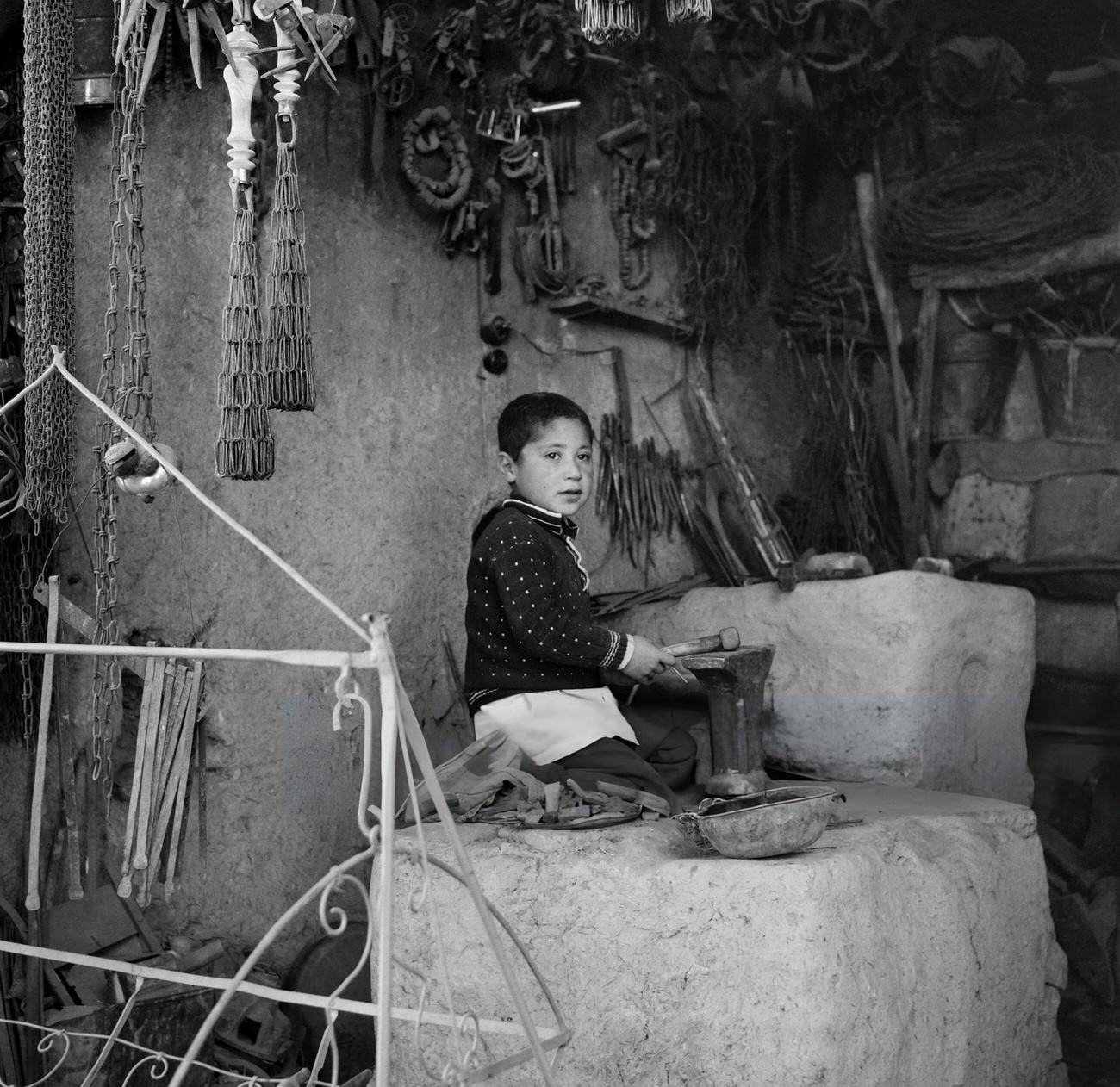 A child plays in a workshop in Tehran, 1968.