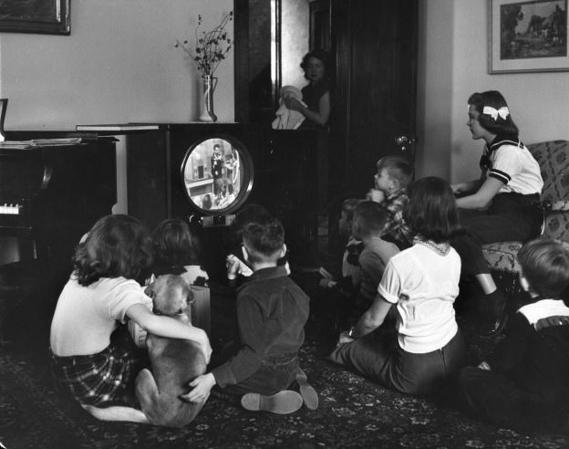 Grade school kids in Minneapolis watch a video "classroom lesson" on TV while the city's public schools are on strike in 1951