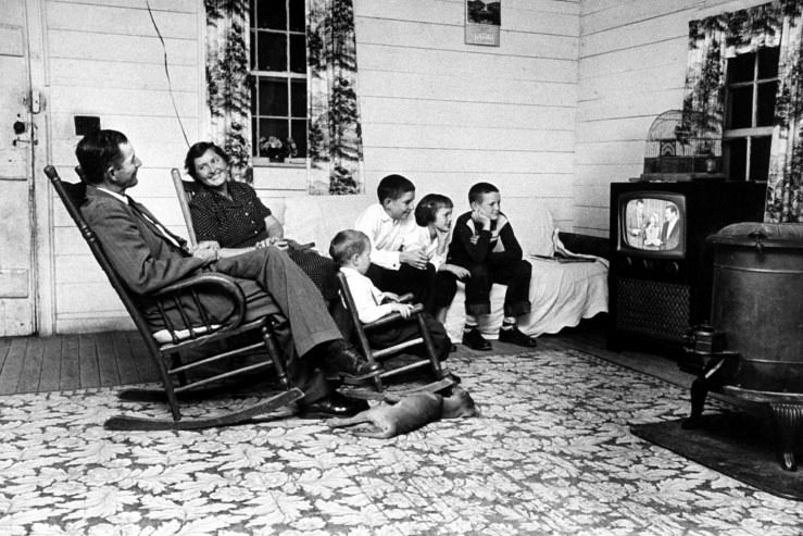 Tenant farmer Thomas B. Knox and his family watch Ed Sullivan and ventriloquist Rickie Layne on The Ed Sullivan Show in 1958