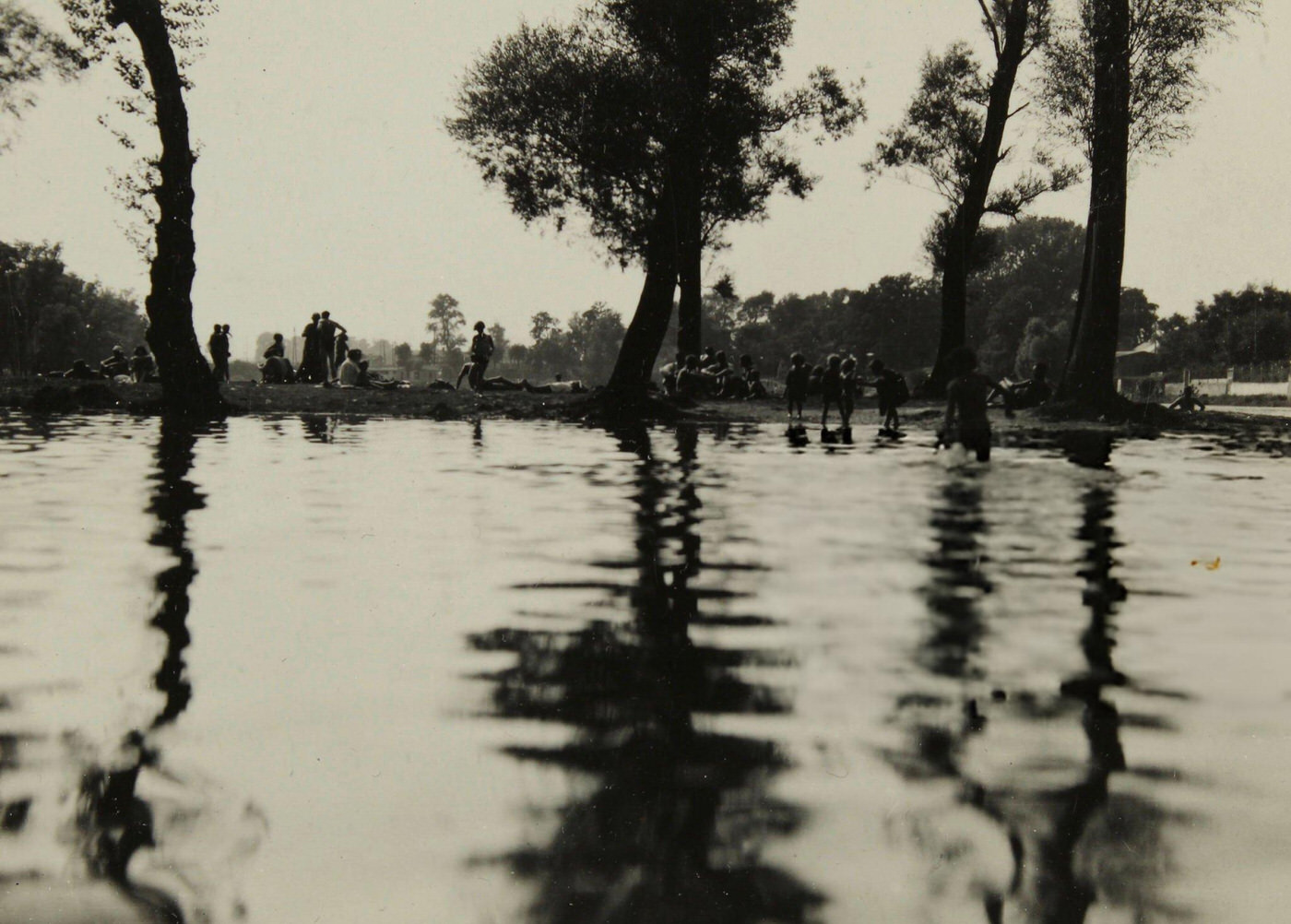 Bathers at the public bathing beach 'Gaensehaeufel' on the banks of the Old Danube, Vienna, 1930.