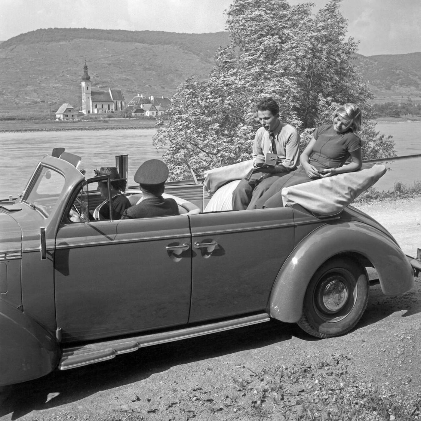 Cruising in an Opel Blitz convertible in Austria, 1930s.